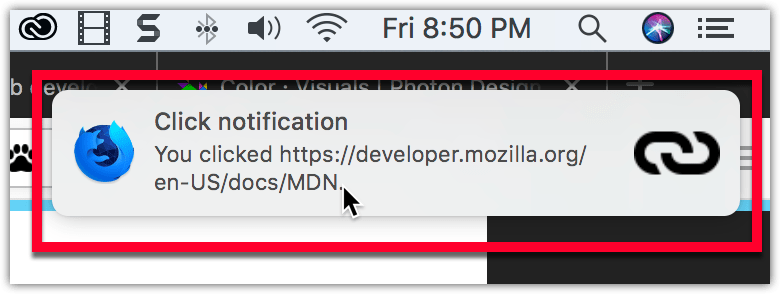 在 macOS 上的示例通知:通知位于系统时钟下方,有一个粗体标题“Click notification”,接着是一段正常字体的文本“You clicked https://developer.mozilla.org/en-US/docs/MDN”。通知的左侧有 Firefox Nightly 的标志,右侧有一个链接图标。